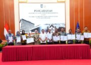 Bupati Luwu Dukung Pengaktifan Siskamling: Pembangunan Lancar, Ekonomi Tumbuh